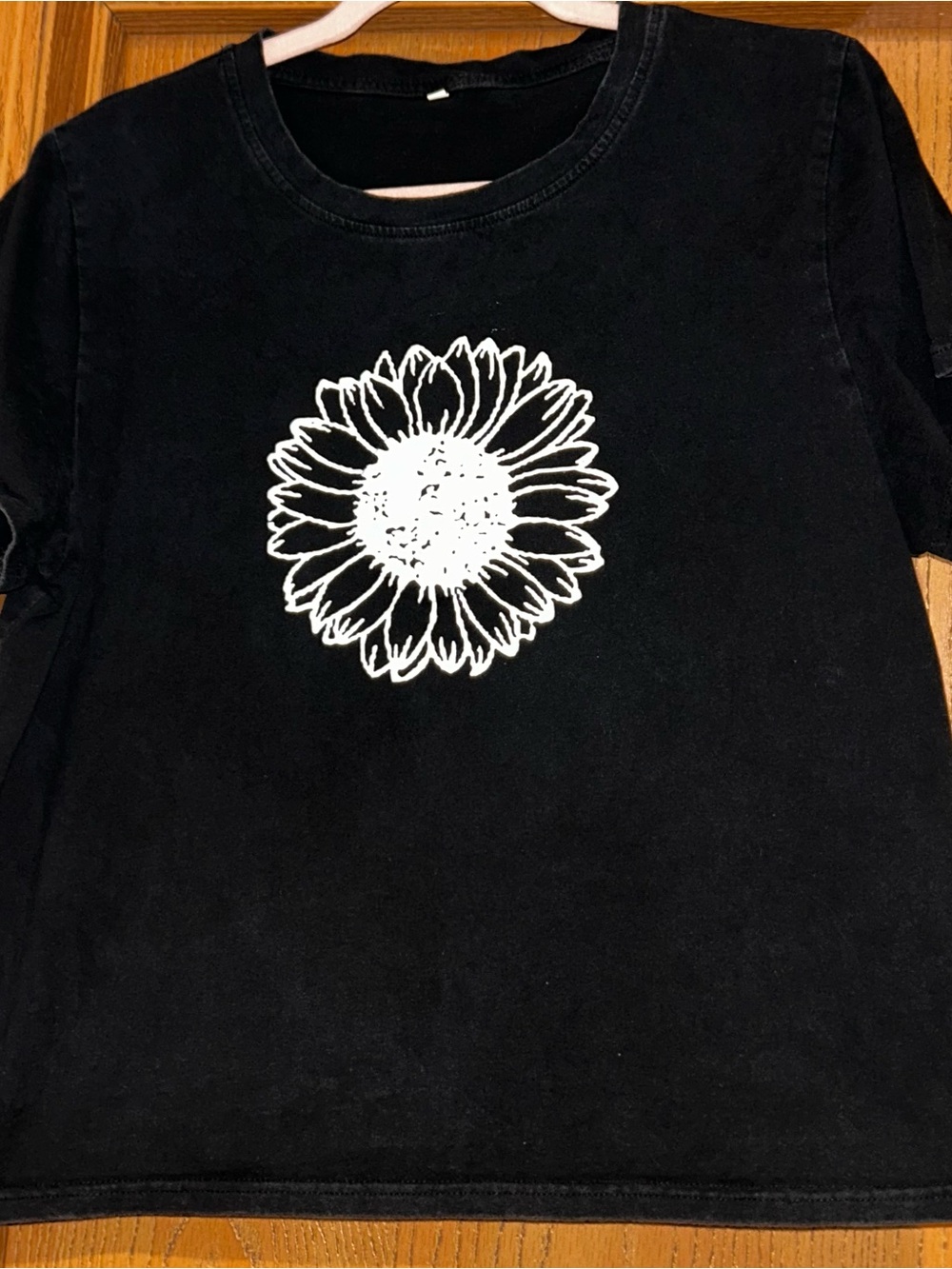 Black Short-Sleeve Women’s Tee with White Sunflower Graphic